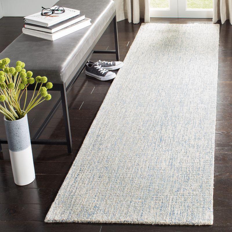 Ivory and Blue Abstract Hand-Tufted Wool Accent Rug - 27" x 4"