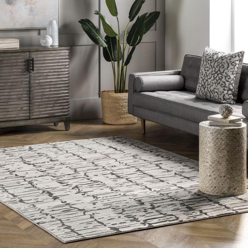 Ivory Abstract Synthetic 5' x 7' Easy Care Area Rug