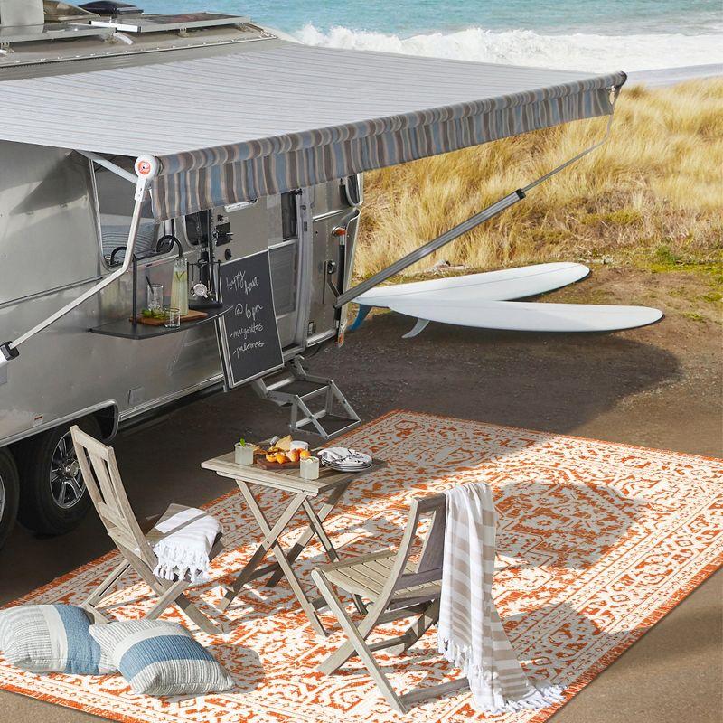 9' x 12' Sinjuri Medallion Textured Weave Indoor/Outdoor Area Rug, Orange/Cream - JONATHAN Y