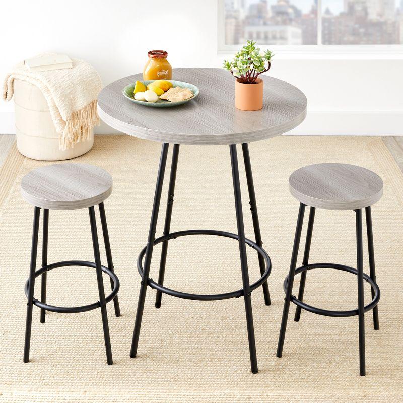 17 Stories Sevon 3-Piece Bistro Set, Modern Round Counter Height Dining Set w/ 2 Stools, Metal Frame