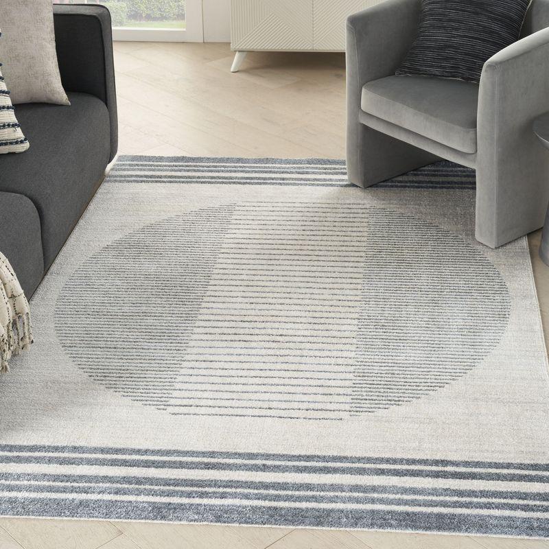 Nourison Astra Machine Washable Stripe Circle Mid-Century Modern Indoor Rug Ivory Blue 5'3" x 7'