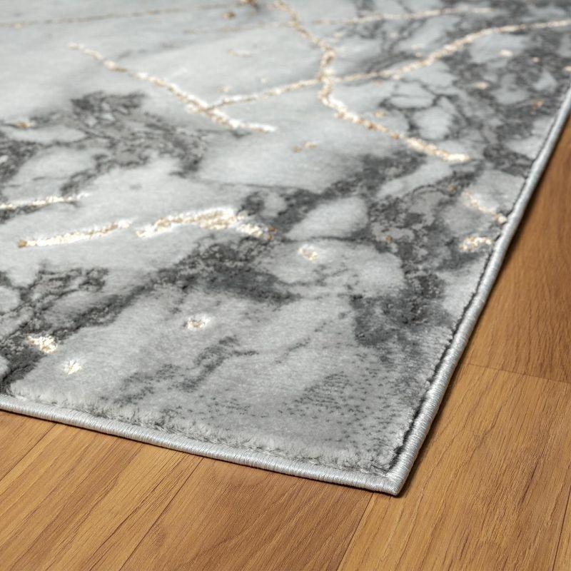 Ivory 5' x 7' Abstract Stain-Resistant Synthetic Area Rug