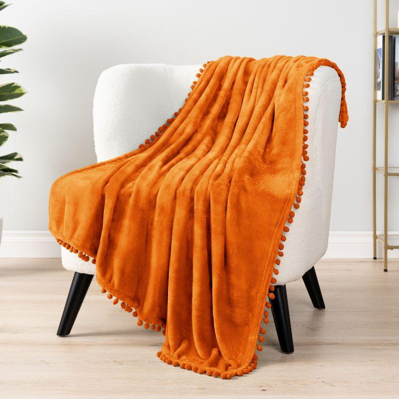 PAVILIA Fleece Pom Pom Blanket Throw for Sofa Bed, Soft Lightweight Pompom Fringe Blanket for Couch