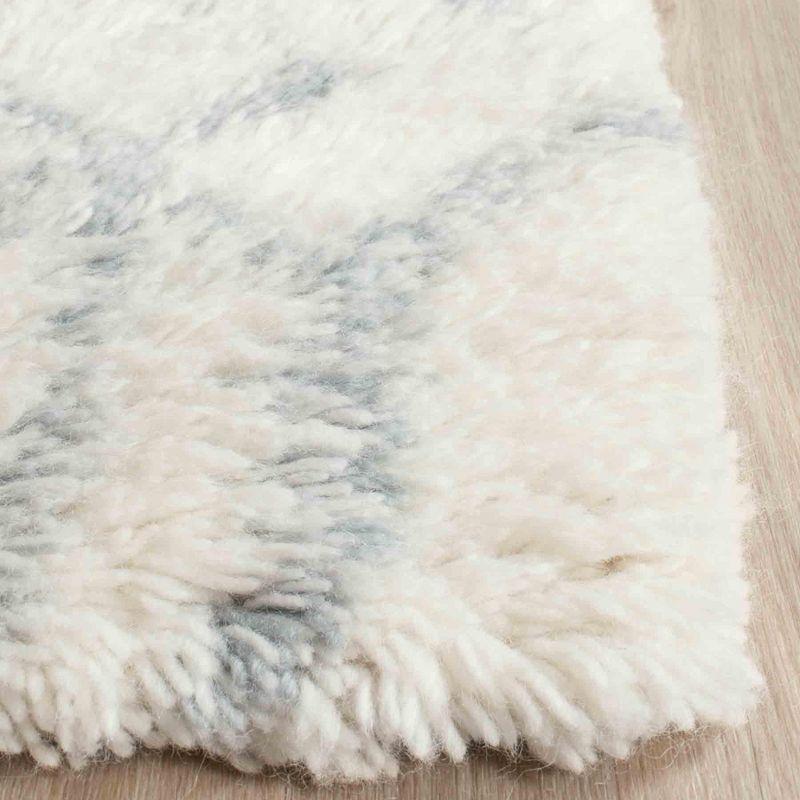 Ivory and Blue 4' x 6' Hand-Tufted Wool Shag Rug