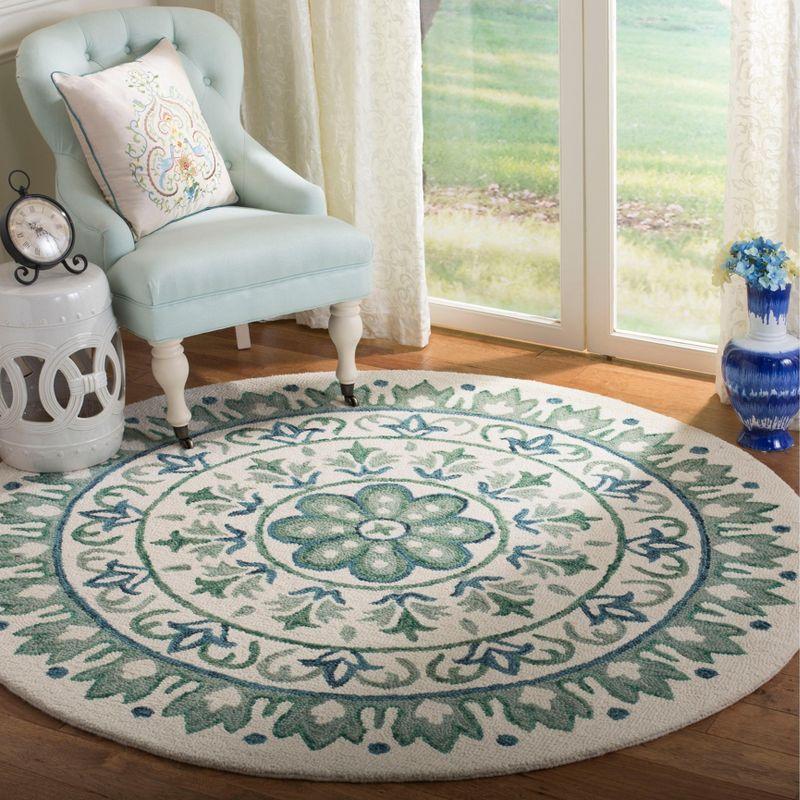 Novelty NOV607 Hand Tufted Area Rug - Ivory/Teal - 6' Round - Safavieh.