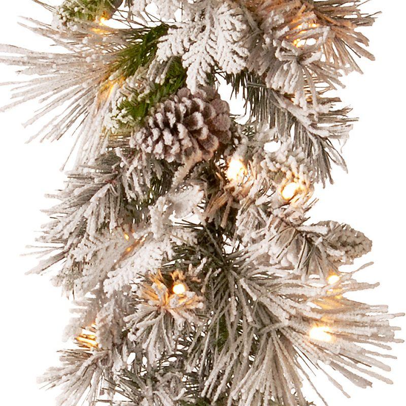 National Tree Company 9 ft. Snowy Bedford Pine Garland with Battery Operated LED Lights