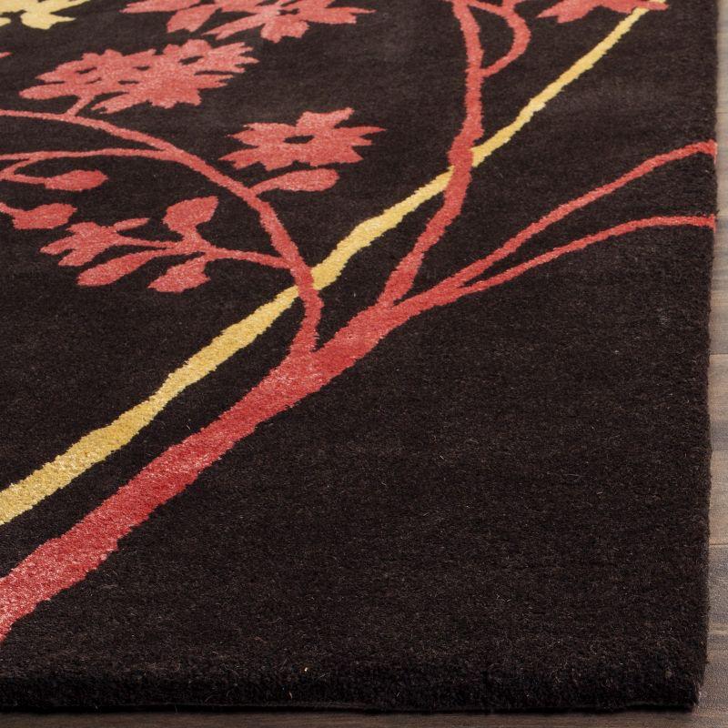 Handmade Brown and Red Floral Wool Area Rug