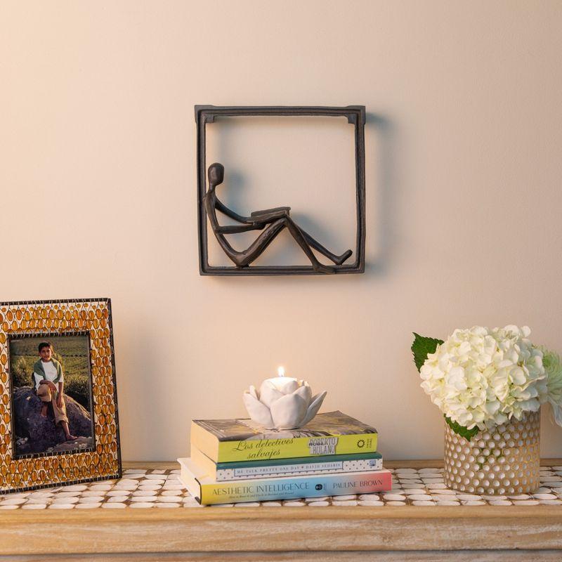 Dark Brown Iron Man Reading on Window Sill Sculpture