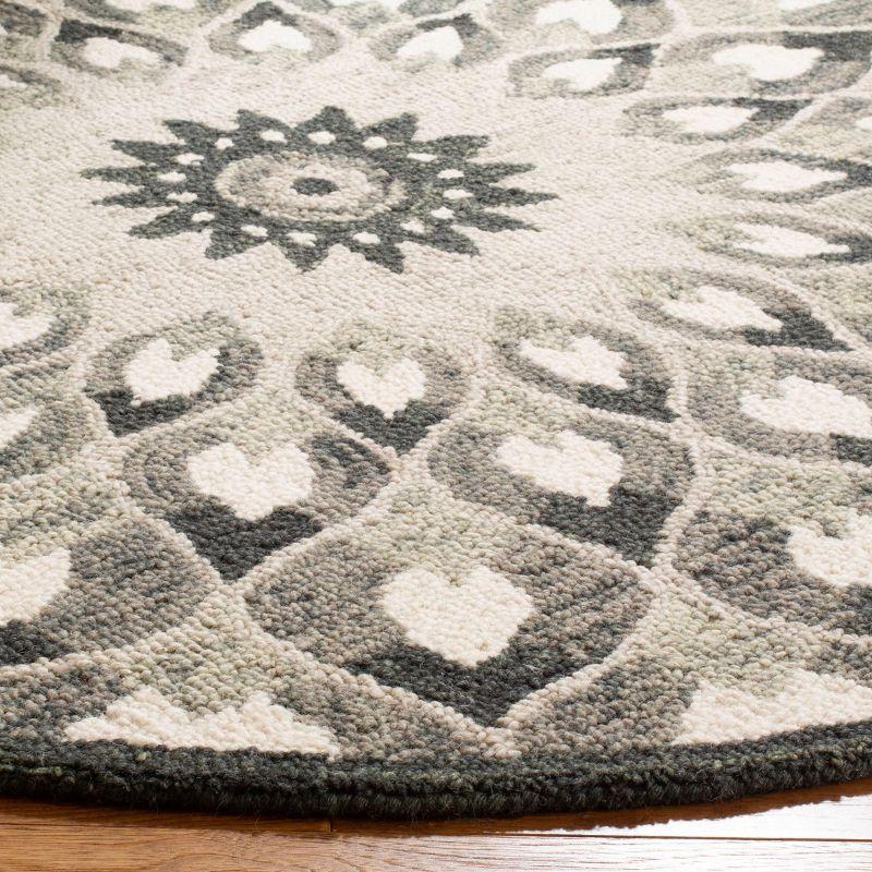 Novelty NOV603 Hand Tufted Area Rug - Charcoal/Ivory - 9' round - Safavieh.