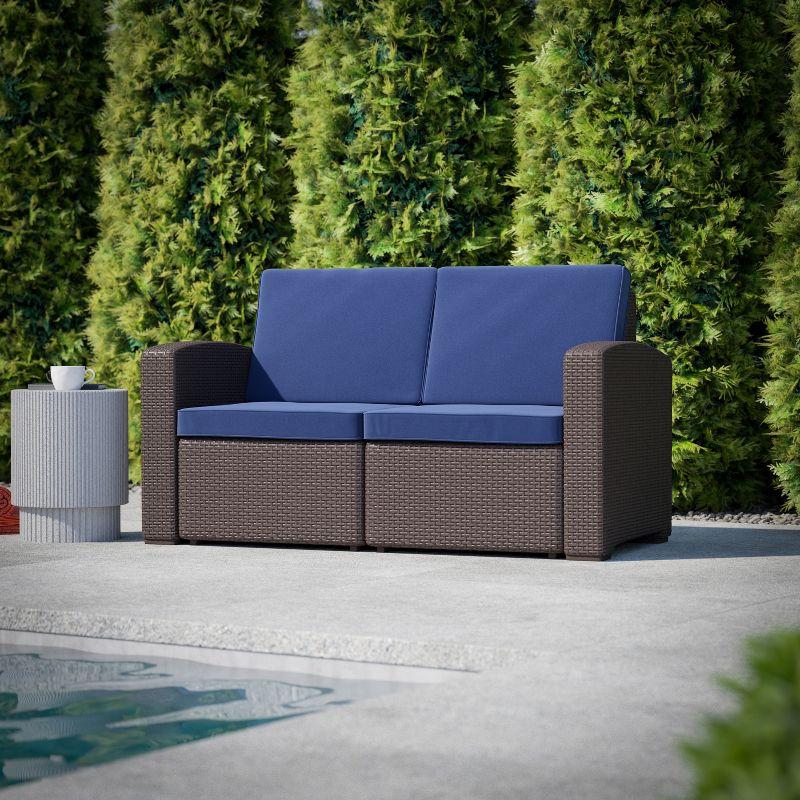 Seneca Brown Faux Rattan Loveseat with Navy Cushions