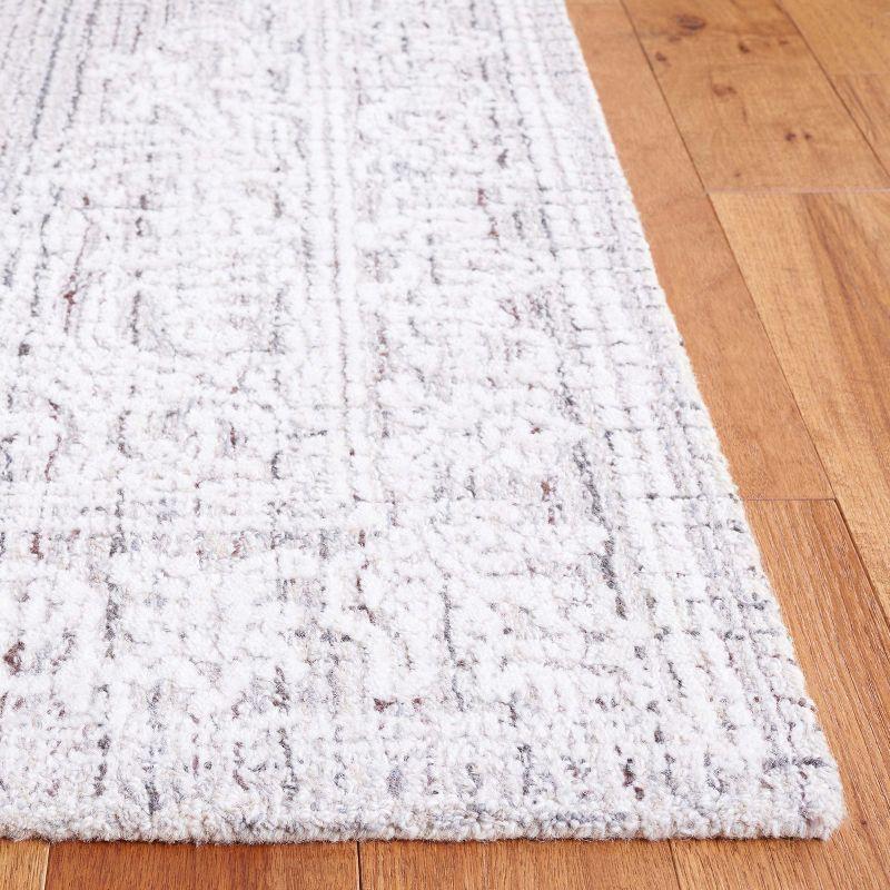 Ivory and Gray Tufted Wool 8' x 10' Area Rug