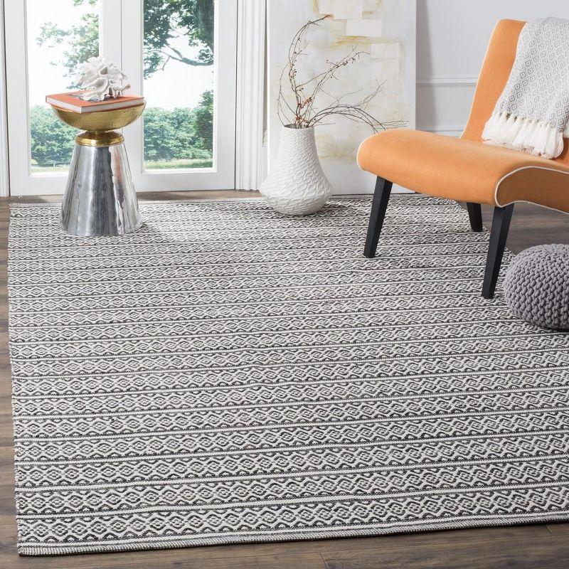 Ivory and Black Handwoven Cotton 6' x 9' Area Rug