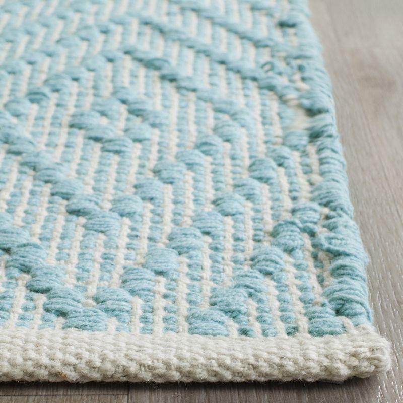 Turquoise and Ivory Geometric Cotton 4' x 6' Area Rug