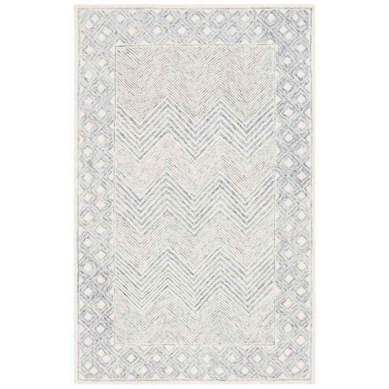 Ivory and Gray Hand Tufted Wool 4' x 6' Area Rug