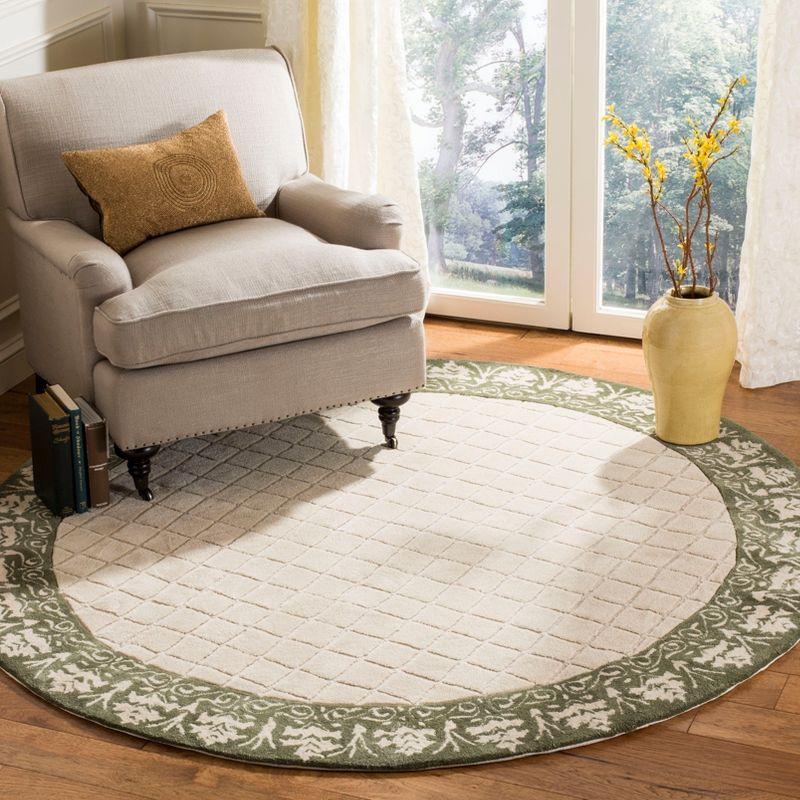 Ivory and Cream Hand-Hooked Round Wool Area Rug