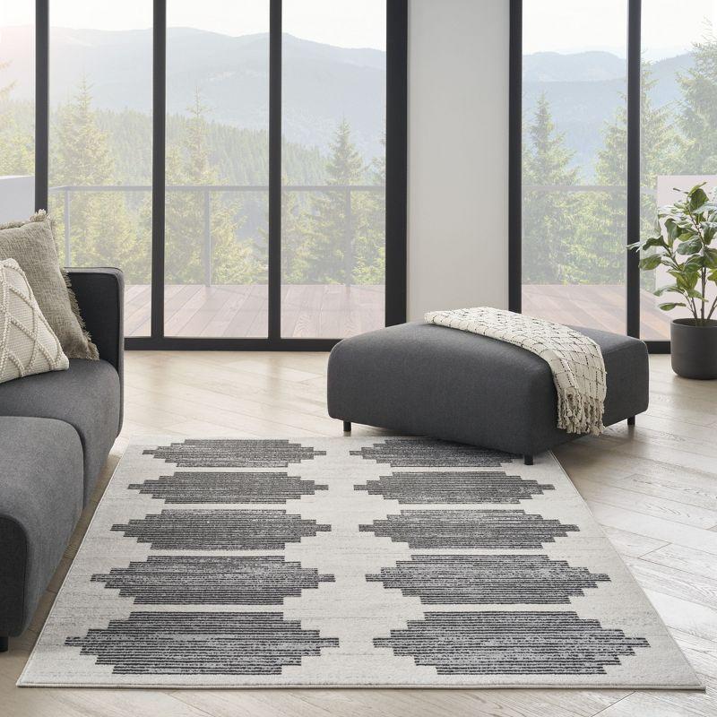 Ivory and Grey Geometric 5' x 7' Synthetic Area Rug