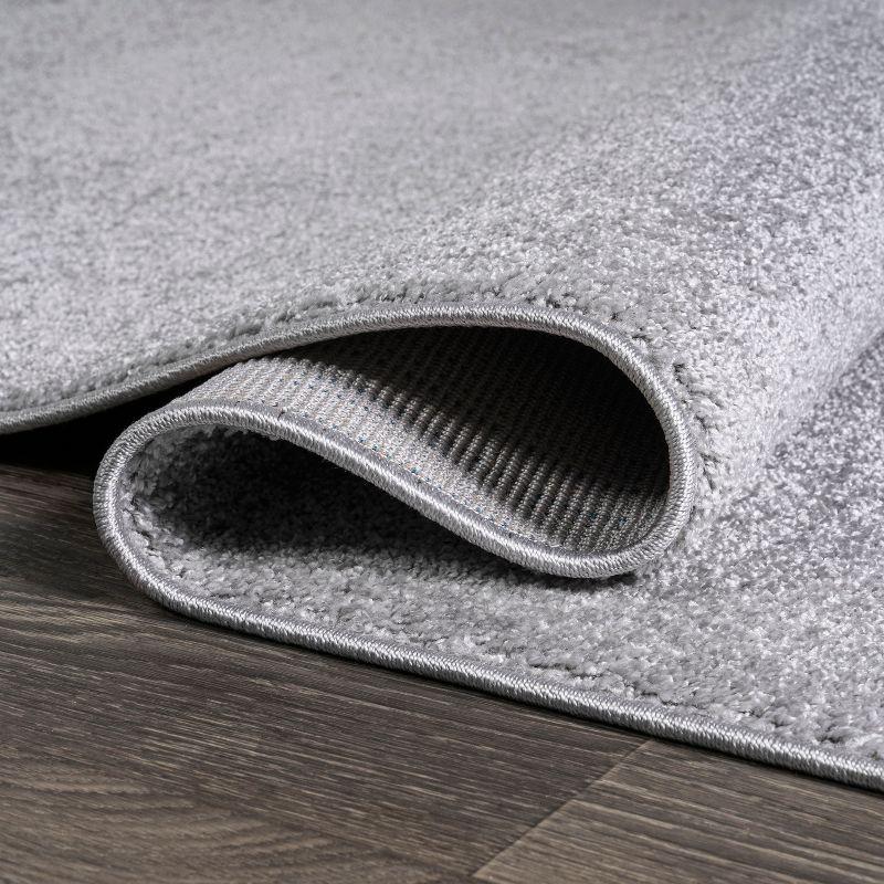 5'x8' Haze Solid Low-Pile Area Rug, Light Gray - JONATHAN Y