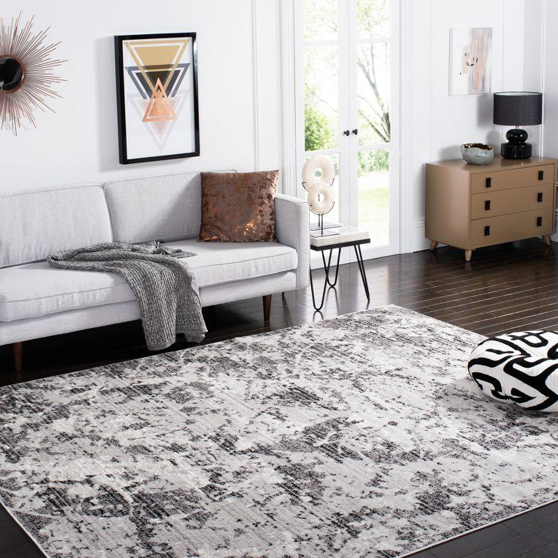 Ivory & Charcoal Abstract Synthetic 9' x 12' Easy-Care Area Rug