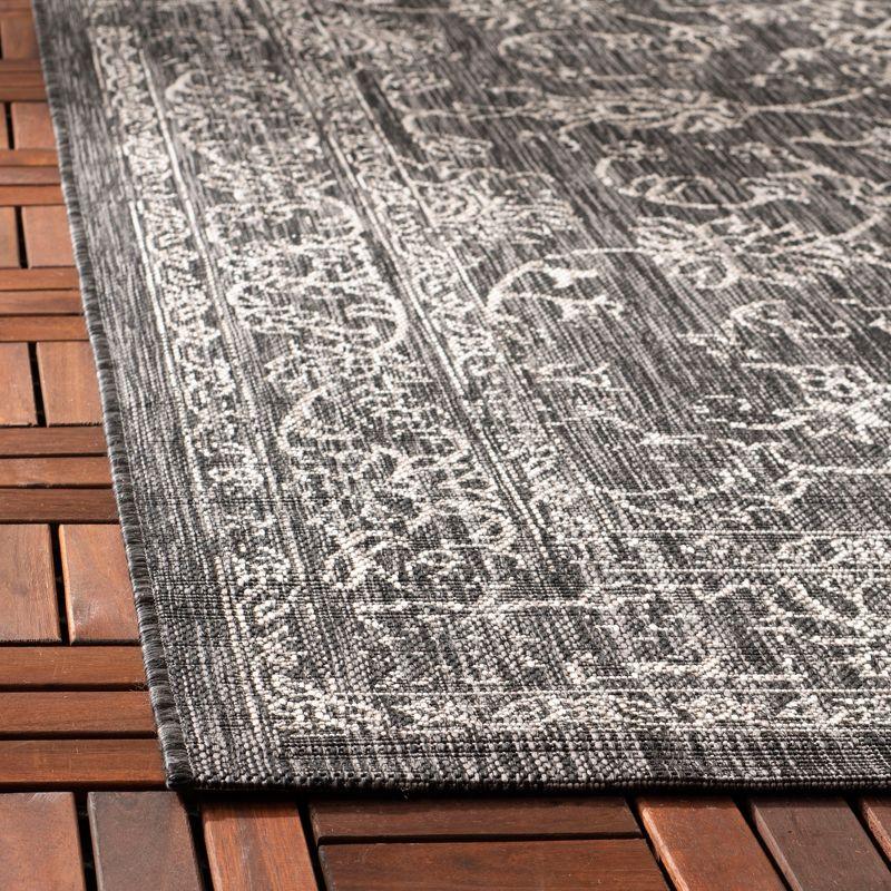 Courtyard Elegance 6'7" Square Black & Ivory Synthetic Area Rug