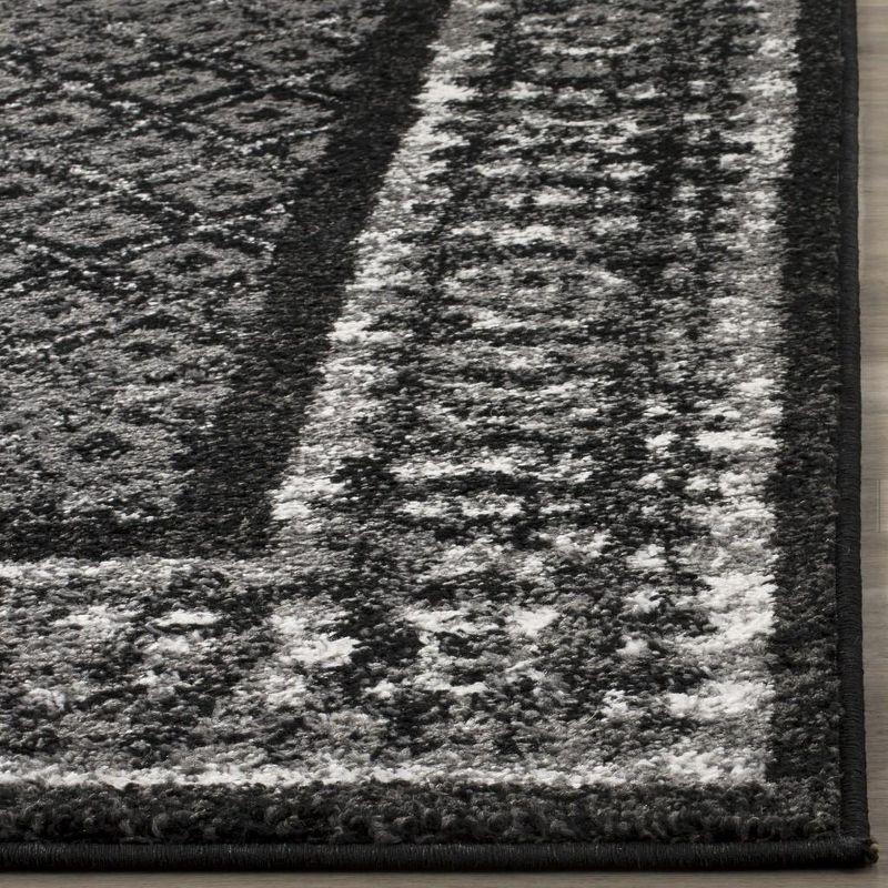 6' x 9' Black and Silver Synthetic Reversible Area Rug