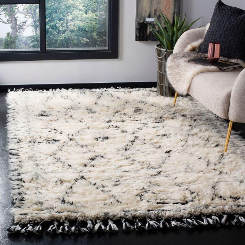 Hand-Knotted Black and Ivory Wool Area Rug with Fringe