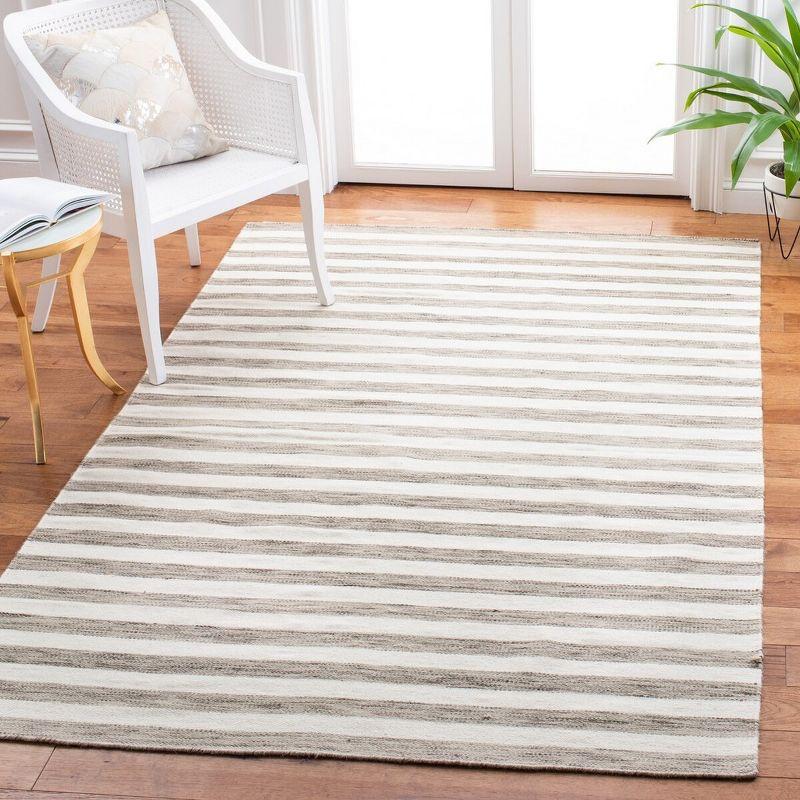Dhurries DHU575 Hand Woven Flat Weave Area Rug Brown / Ivory 6' X 9' - Safavieh.