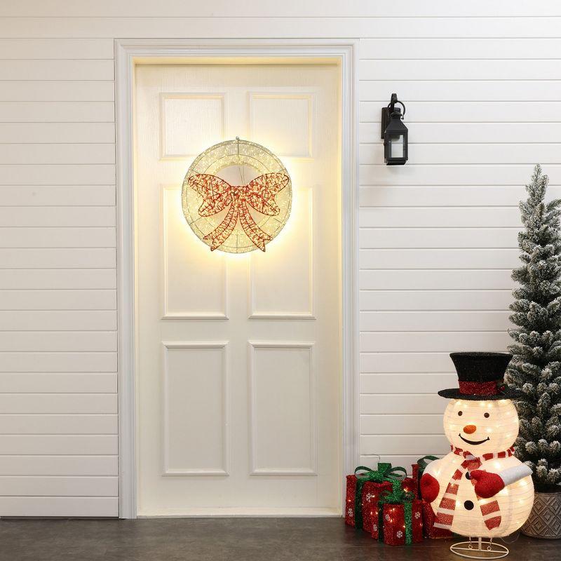 LuxenHome 1.6Ft Round Light Wreath and Red Light Bow Holiday Decoration with Timer Clear