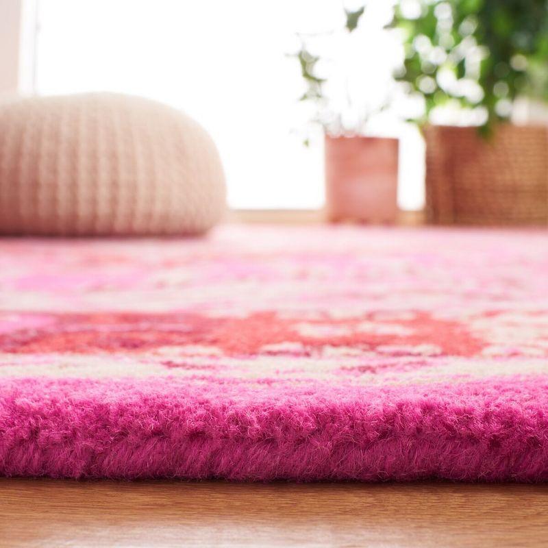 Handmade Bohemian Chic Red & Pink Wool Area Rug - 4' x 6'