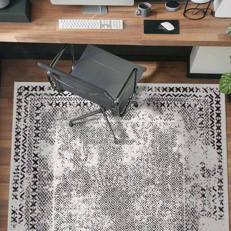 Black Geometric 5' x 7' Synthetic Easy Care Area Rug