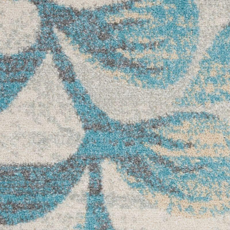 Ivory and Turquoise Floral Synthetic 4' x 6' Area Rug