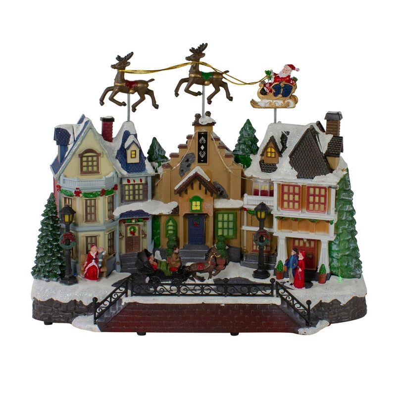 Northlight Seasonal 16" White and Brown LED Lighted and Animated Christmas Village with Flying Sleigh Tabletop Decor