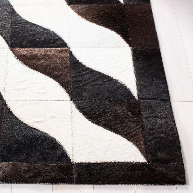 Handmade Black Geometric Cowhide Area Rug