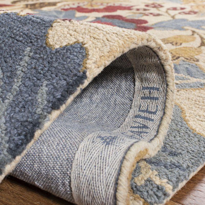 Handmade Beige and Multi Floral Wool Area Rug