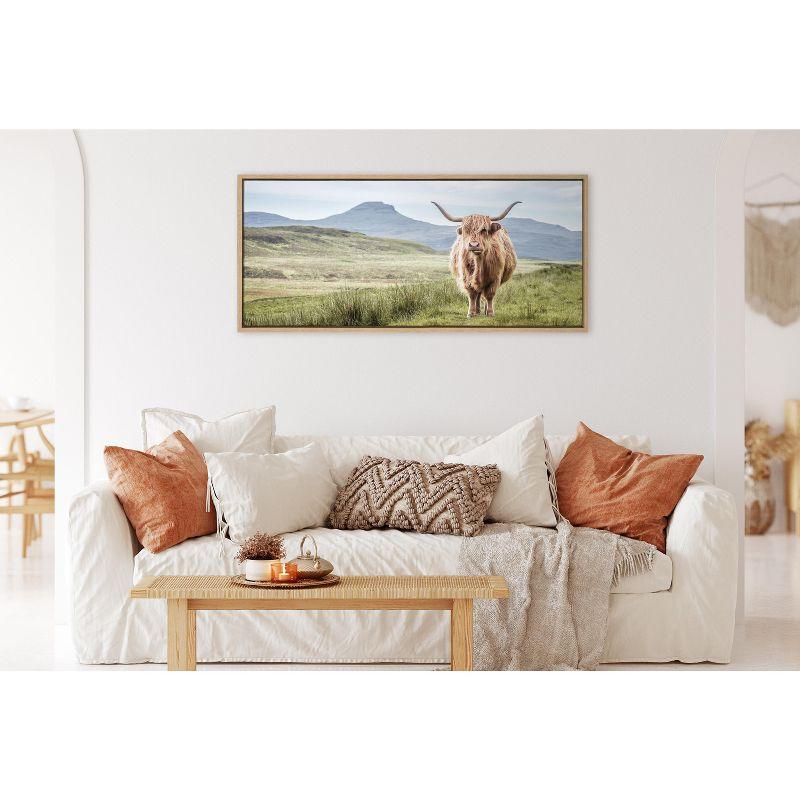 Kate and Laurel Sylvie Highland Cow Mountain Landscape Framed Canvas by The Creative Bunch Studio