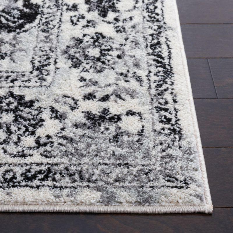 Ivory and Black Square Synthetic Area Rug