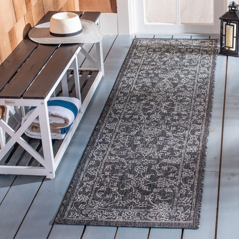 Courtyard CY8680 UV & Stain Resistant Non-Shedding Power Loomed Indoor/Outdoor Runner Rug - Black/Ivory - 2'3"x6'7" - Safavieh