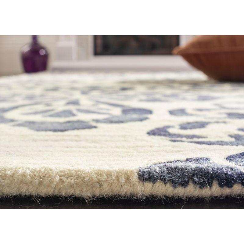 Dip Dye DDY719 Hand Tufted Area Rug - Ivory/Navy - 8'x10' - Safavieh.