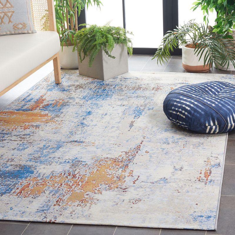 Ivory Abstract Synthetic 4' x 6' Area Rug