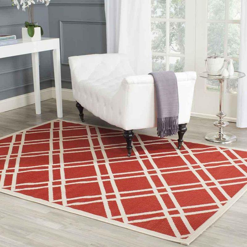 Red and Bone Geometric Synthetic Indoor/Outdoor Area Rug