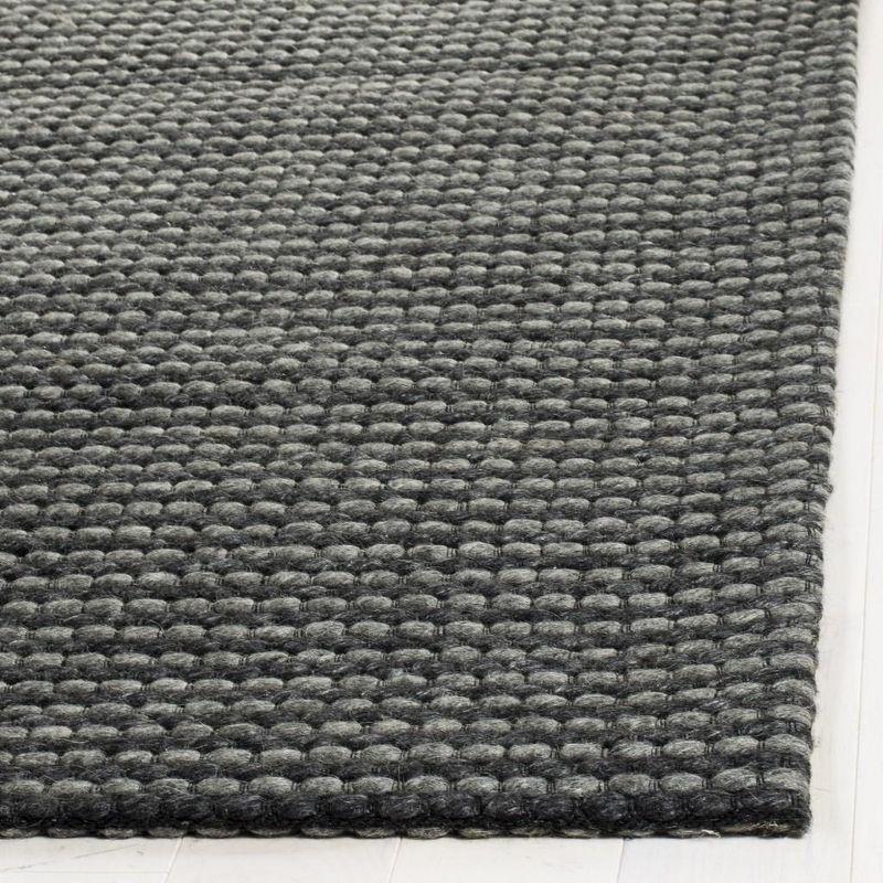 Handmade Black Wool and Synthetic Tufted Rectangular Rug