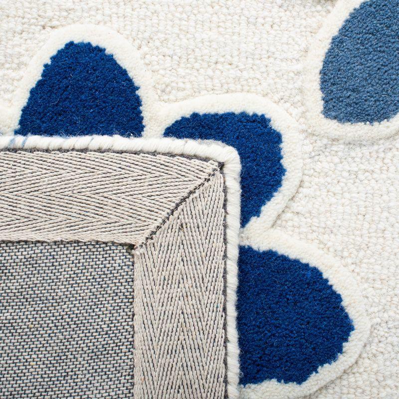 Safavieh Kids SFK923 Hand Tufted Area Rug - Ivory/Blue - 5'x8' - Safavieh.