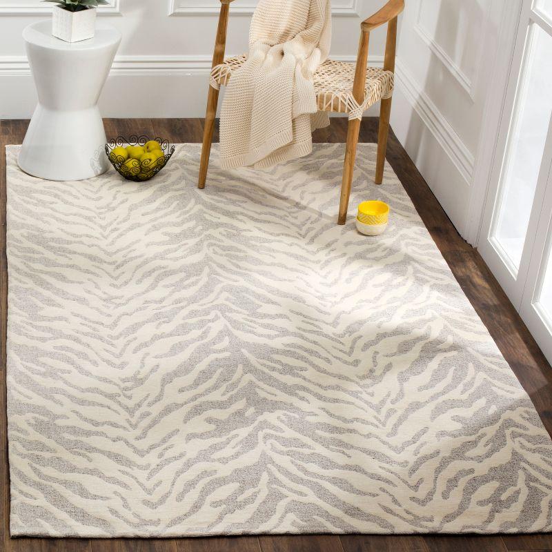 Light Grey and Ivory Rectangular Hand Loomed Area Rug