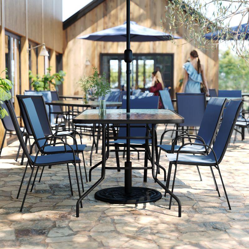 Flash Furniture Brazos 7 Piece Outdoor Patio Dining Set - 55" Tempered Glass Patio Table with Umbrella Hole, 6 Navy Flex Comfort Stack Chairs