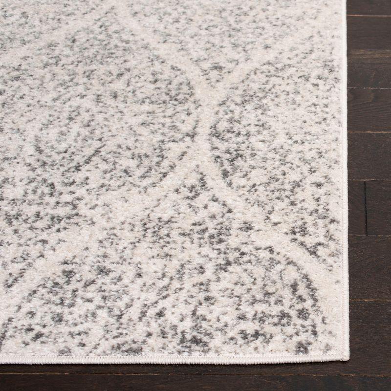 Ivory and Silver Geometric 8' x 10' Synthetic Area Rug