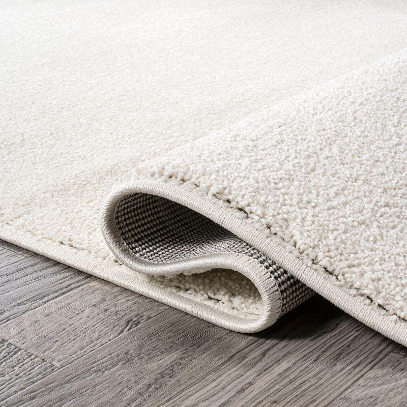 3'x5'Oval  Haze Solid Low-Pile, Cream - JONATHAN Y