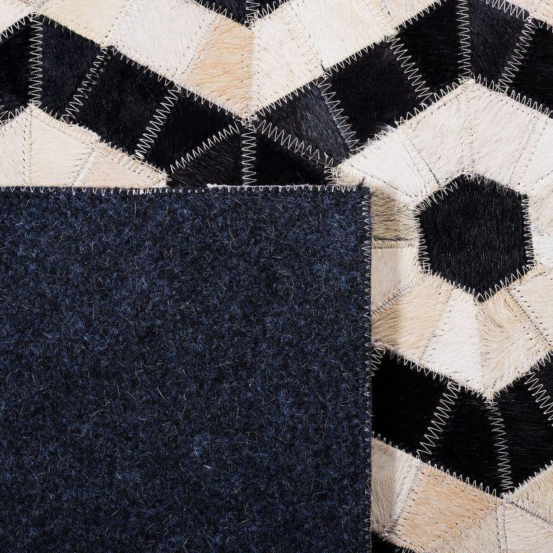 Black and Beige Geometric Handmade Cowhide Area Rug