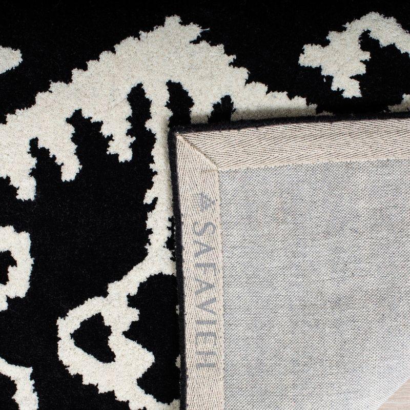 Handmade Black and Ivory Tufted Wool Area Rug