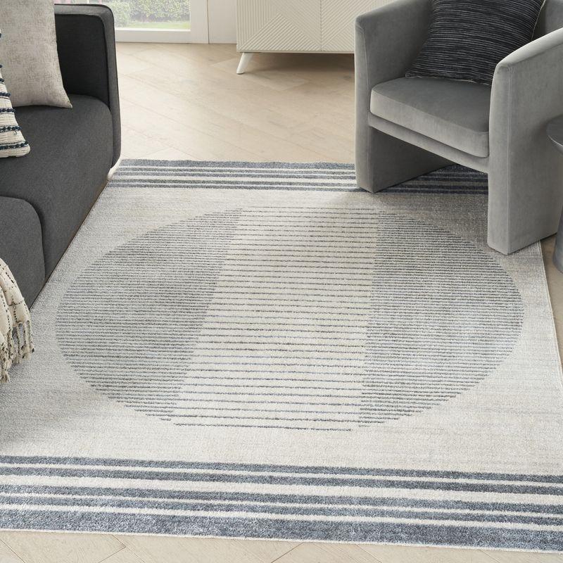 Nourison Astra Machine Washable Stripe Circle Mid-Century Modern Indoor Rug Ivory Blue 5'3" x 7'
