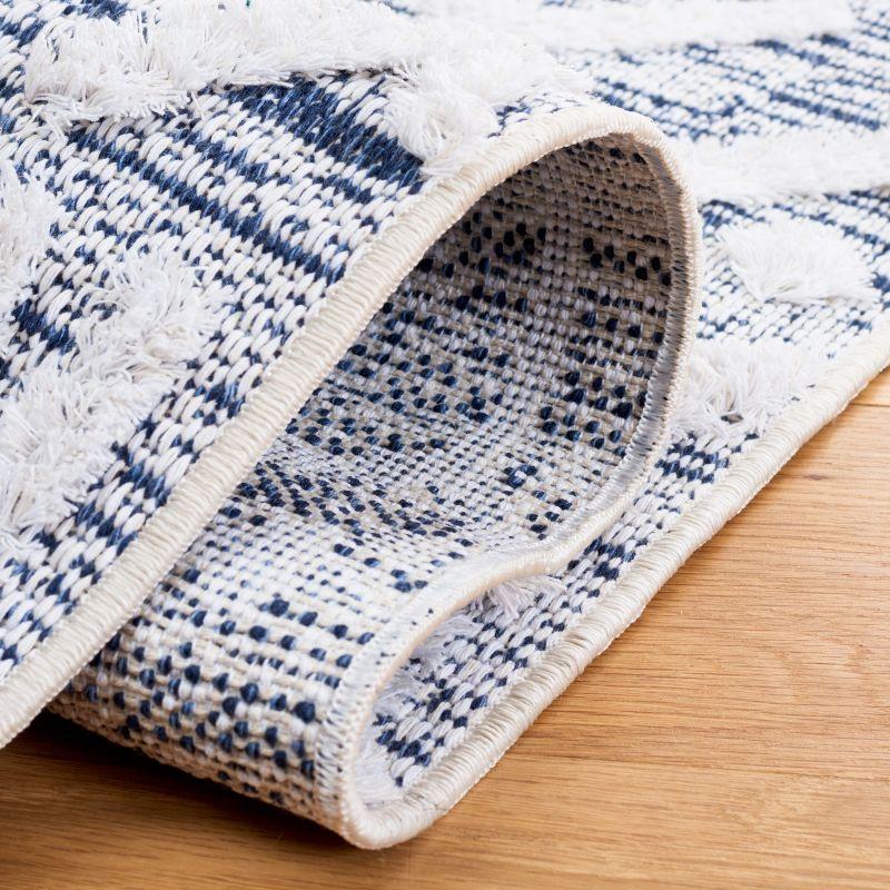 Ivory and Blue Nomadic Pattern 5' x 7' Synthetic Area Rug