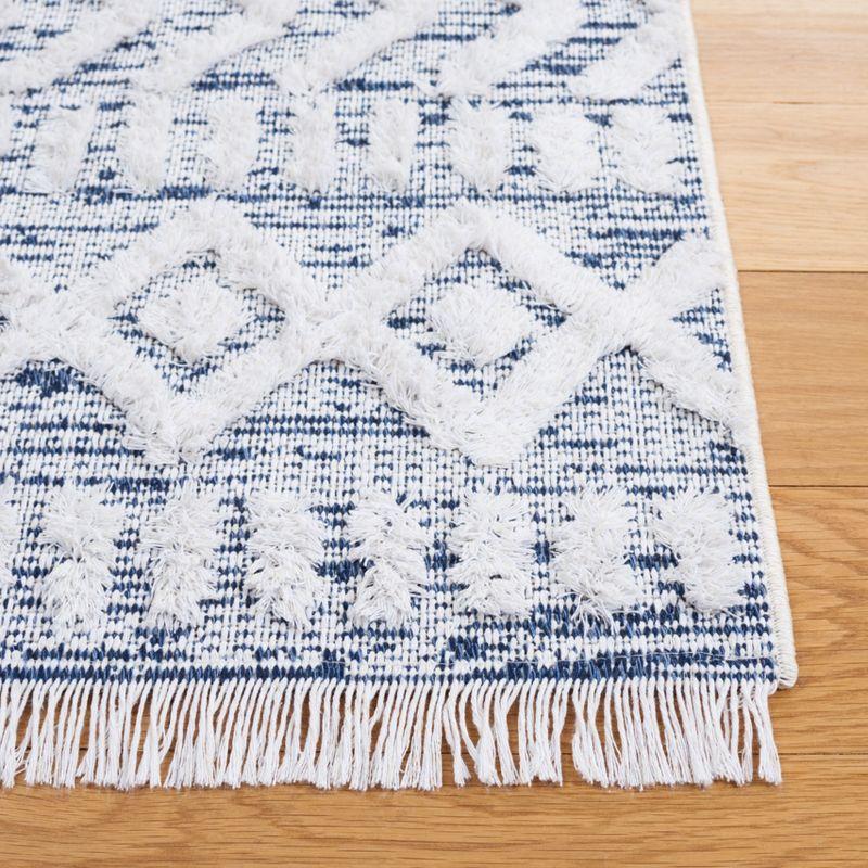 Ivory and Blue Nomadic Pattern 5' x 7' Synthetic Area Rug